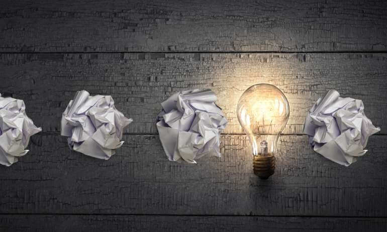 Crumpled paper and light bulb